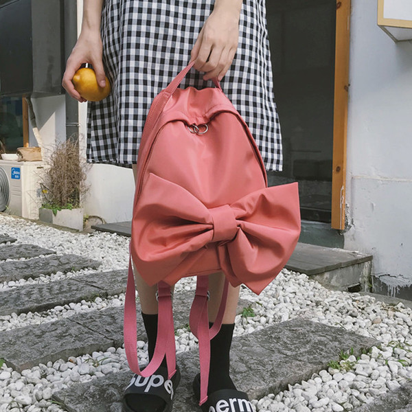 Modern női hátizsák három színben szalaggal