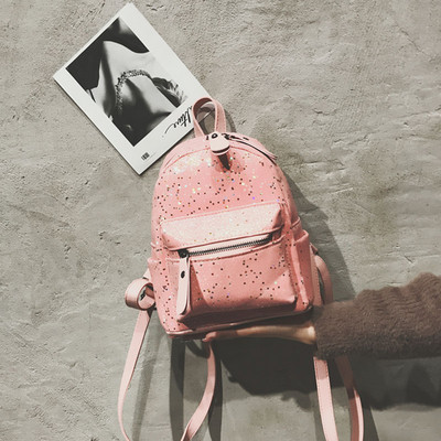 Γυναικείο σακίδιο με μπροκάρ και μπροστινή τσέπη σε διάφορα χρώματα