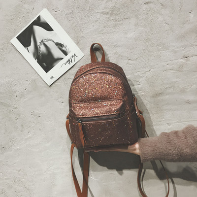 Γυναικείο σακίδιο με μπροκάρ και μπροστινή τσέπη σε διάφορα χρώματα