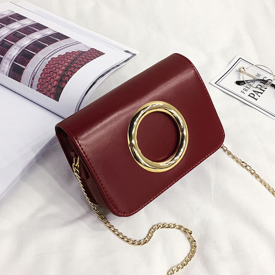 Κομψή γυναικεία τσάντα με μεταλλική λαβή σε διάφορα χρώματα