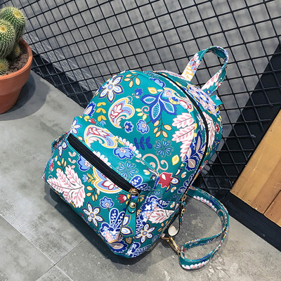 Γυναικείο σακίδιο με φυτικά μοτίβα και μπροστινή τσέπη σε τρία χρώματα