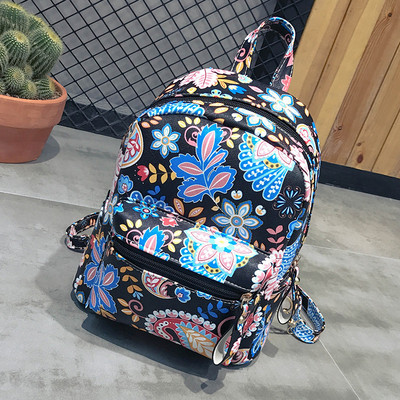 Γυναικείο σακίδιο με φυτικά μοτίβα και μπροστινή τσέπη σε τρία χρώματα