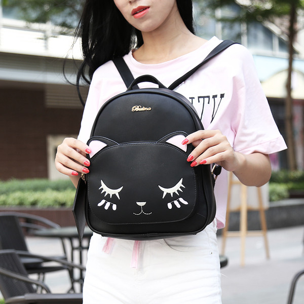 Rucsac de damă negru cu broderie și o geantă mică de voiaj