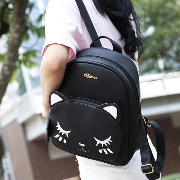 Rucsac de damă negru cu broderie și o geantă mică de voiaj