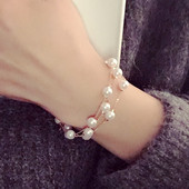 Modern női karkötő gyöngyökkel, arany színben