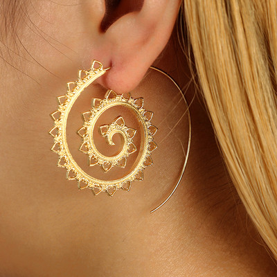 An interesting model of women`s earrings in gold and silver