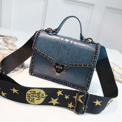 Σύγχρονη  γυναικεία τσάντα με μεταλλικό κούμπωμα σε τέσσερα χρώματα