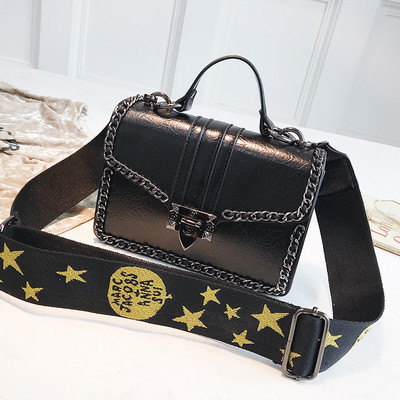 Σύγχρονη  γυναικεία τσάντα με μεταλλικό κούμπωμα σε τέσσερα χρώματα