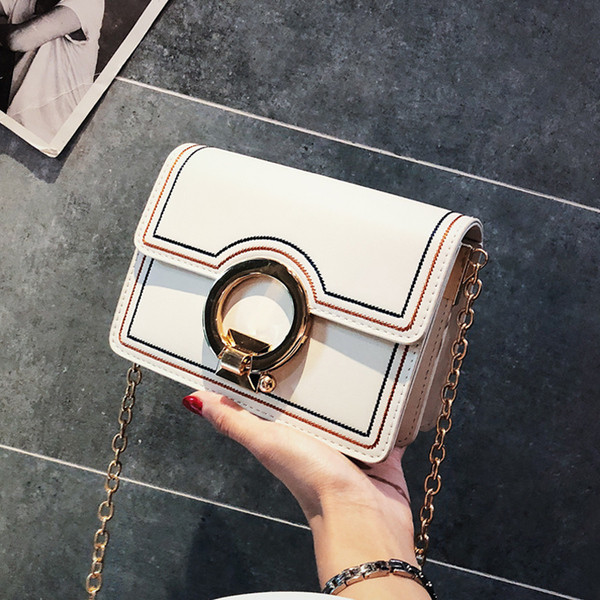 Stílusos női kis táska fém fogantyúval több színben