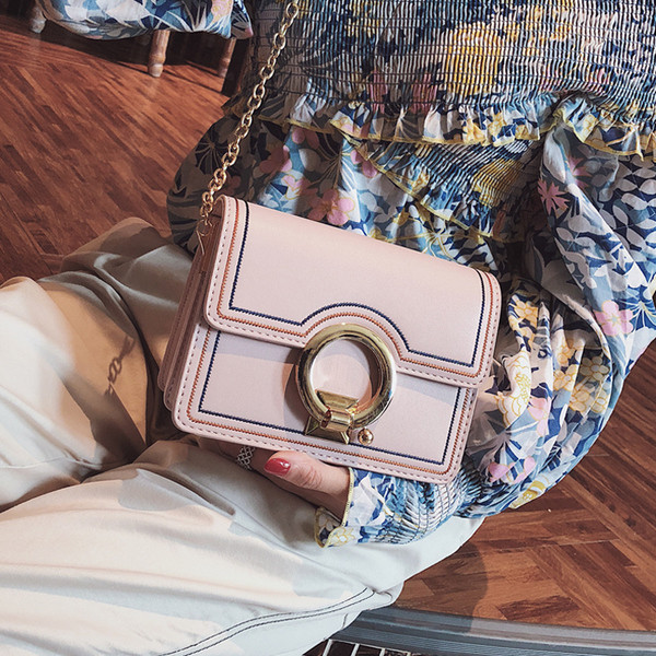 Stílusos női kis táska fém fogantyúval több színben