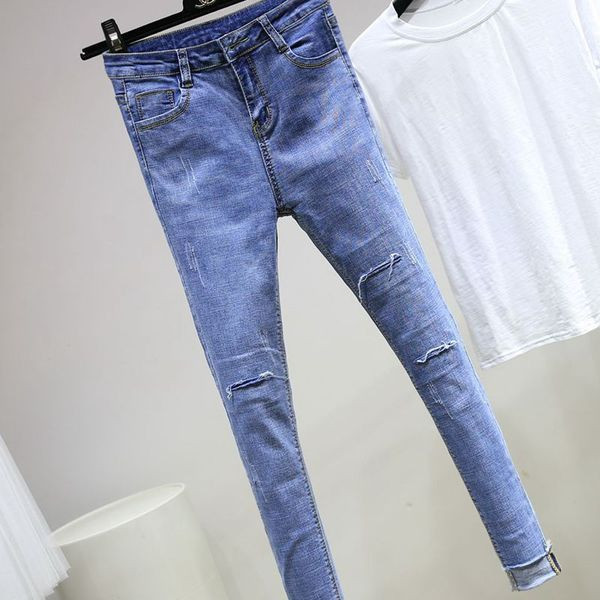 Tiszta női farmer magas derékkal, szakadt elemekkel