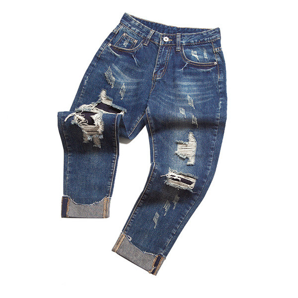 Modern női farmer kék színben, szakadt motívumokkal