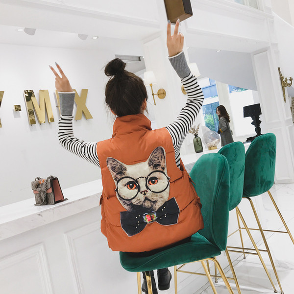 Női mellény fekete és narancssárga hátoldalán mintával