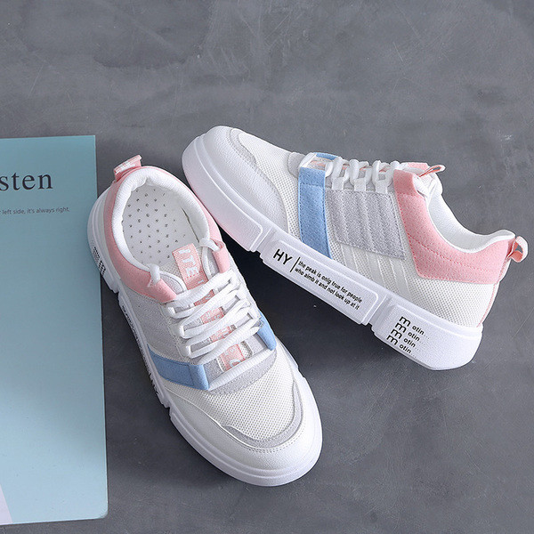 Τρέχοντα λευκά κυρίες παπούτσια