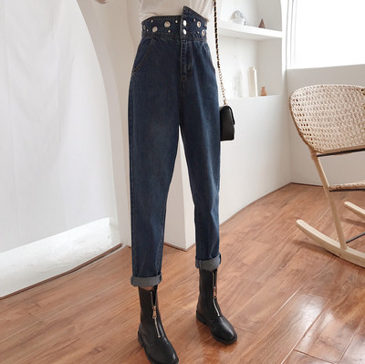 Modern women`s jeans with a high waist and metal elements in two colors