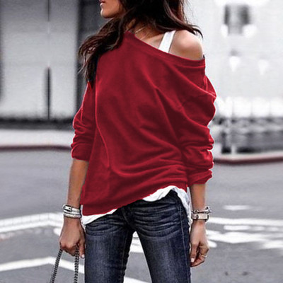 Casual women`s blouse with a dropped shoulder in several colors