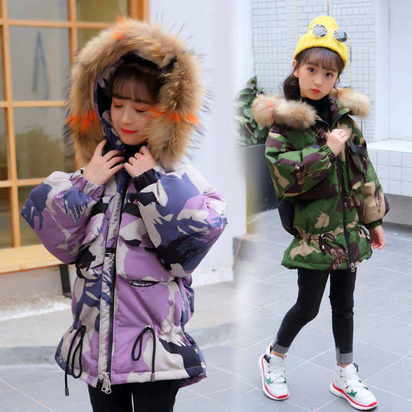 Téli gyerekdzseki terepszínű mintával zöld és lila színben