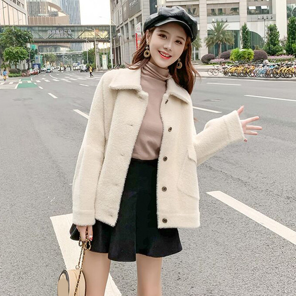 Elegáns női kabát fehér színben