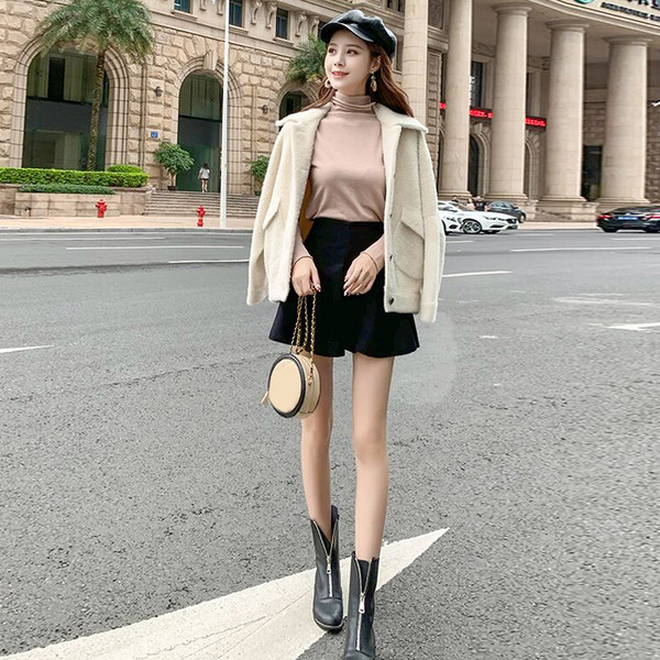 Elegáns női kabát fehér színben