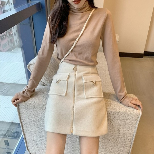 Női téli szoknya zsebekkel és cipzárral több színben