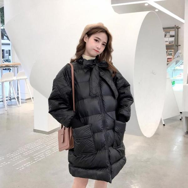 Зимно дамско яке с джобове и връзки в черен и бял цвят