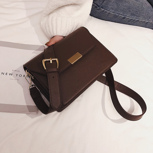 Geanta de dama eleganta din piele ecologica in negru, maro, alb si rosu