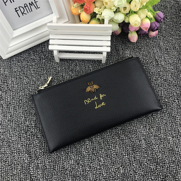 Дамски портфейл с метална декорация и надпис в няколко цвята