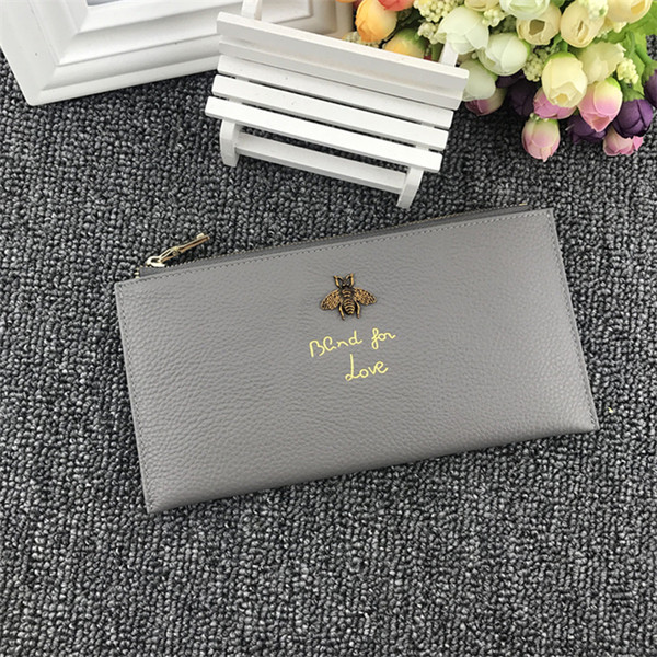 Дамски портфейл с метална декорация и надпис в няколко цвята