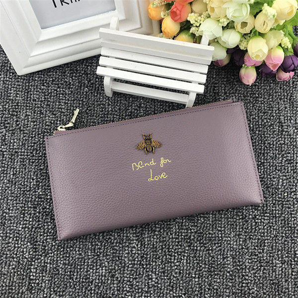 Дамски портфейл с метална декорация и надпис в няколко цвята