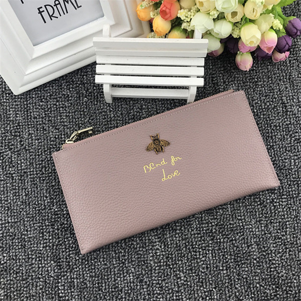 Дамски портфейл с метална декорация и надпис в няколко цвята