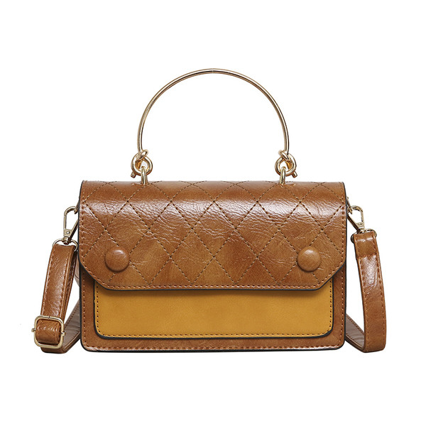 Öt színben fém fogantyúval készült modern női táska öko bőrből