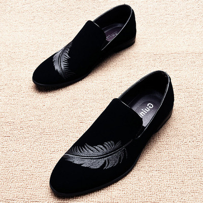 Modern men`s moccasins with embroidery in black