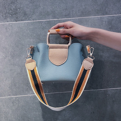 Κομψή γυναικεία τσάντα με μεταλλική λαβή σε τέσσερα χρώματα