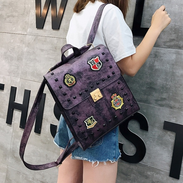 Rucsac de damă de ultimă generație cu ochiuri și embleme în mai multe culori