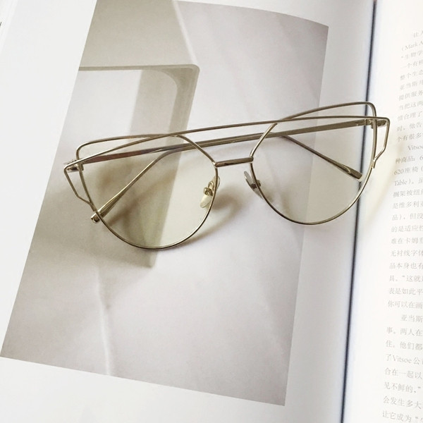 Aktuális átlátszó női szemüveg ezüst, arany és fekete kerettel