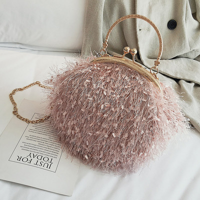 Elegáns női táska fém fogantyúval