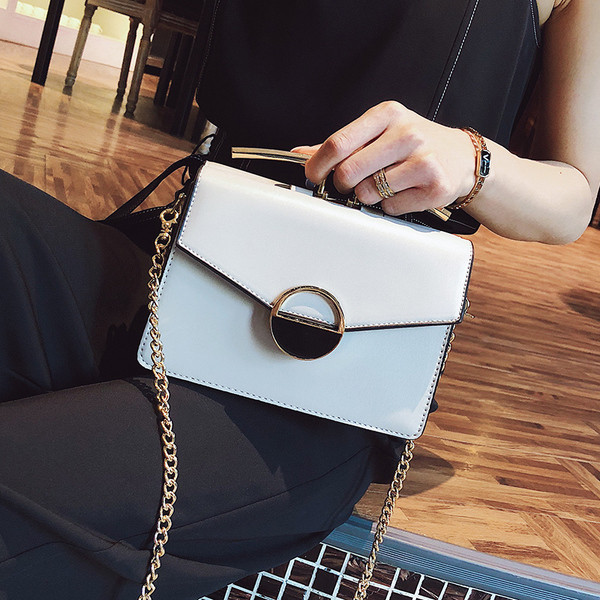 Fém fogantyús női táska négy színben