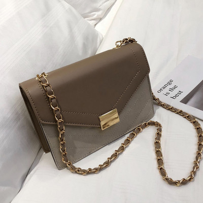 Κομψή γυναικεία τσάντα σε τέσσερα χρώματα με μεταλλική στερέωση