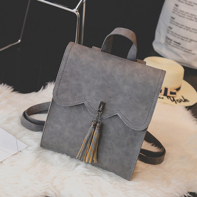 Eko bőrből készült stílusos női hátizsák bojttal, több színben