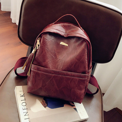 Öko bőrből készült női hátizsák bojttal, három színben