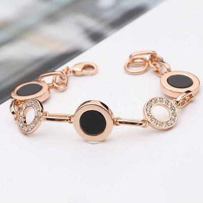 Stílusos női karkötő kövekkel arany és ezüst színben