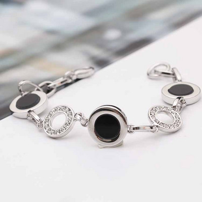 Stílusos női karkötő kövekkel arany és ezüst színben