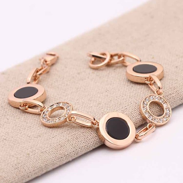 Stílusos női karkötő kövekkel arany és ezüst színben