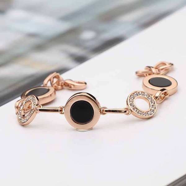 Stílusos női karkötő kövekkel arany és ezüst színben