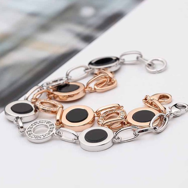 Stílusos női karkötő kövekkel arany és ezüst színben