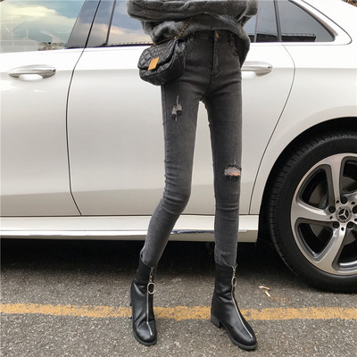 Μοντέρνα γυναικεία τζην με σχισμένα  σχέδια σε γκρι χρώμα