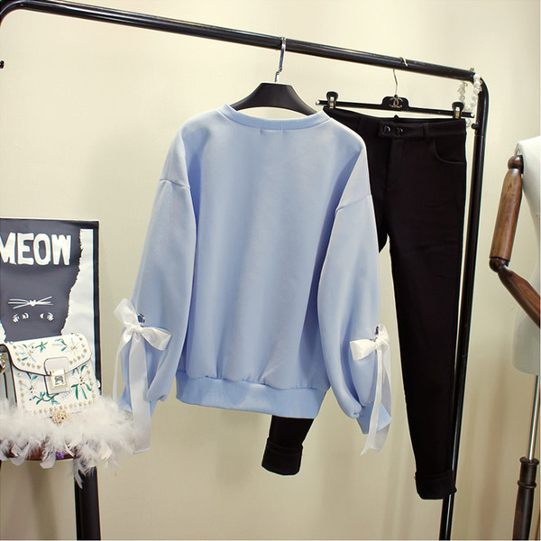 Μοντέρνα γυναικεία μπλούζα σε μπλε και ροζ χρώμα και κορδόνια στα  μανίκια