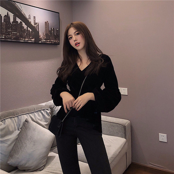 Stílusos női aszimmetrikus fekete blúz, hátul cipzárral