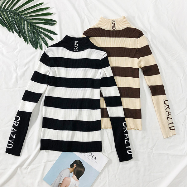 Modern női csíkos pulóver feliratokkal