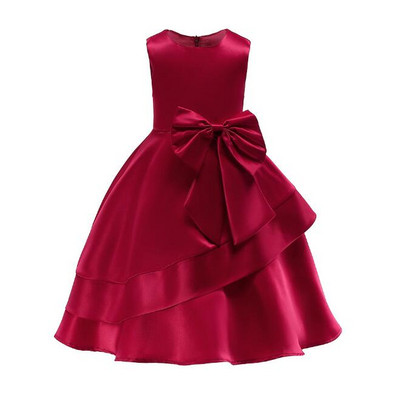 Modern children`s dress with a ribbon in burgundy, pink and blue